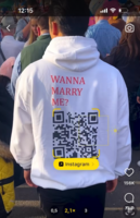 Guy walks around with QR code on hoodie